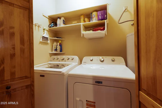 a bathroom with a sink vanity mirror and toilet