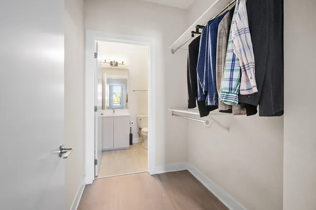a bathroom with a sink toilet and a mirror