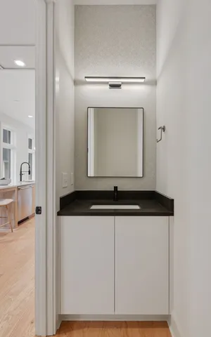 a bathroom with a sink and a mirror