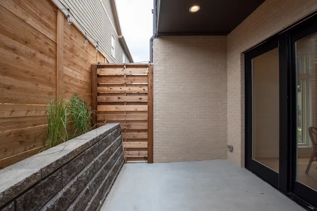 a view of room with stairs and wooden floor