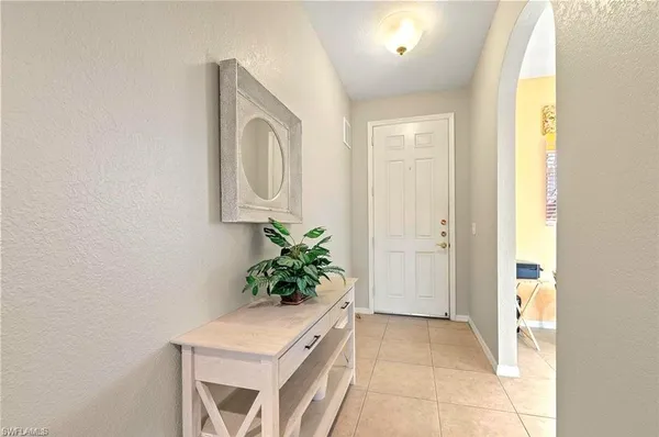 a room with a sink and a mirror