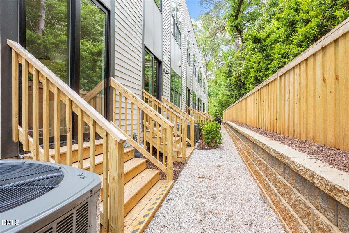 811 Maple Berry Lane, Unit 101 Raleigh, NC 27607 - Photo 42 of 45 a view of balcony with wooden floor and fence