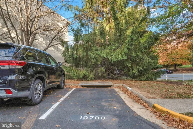 a view of a car parked in front of a house