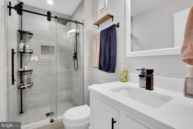 a bathroom with a sink and a shower