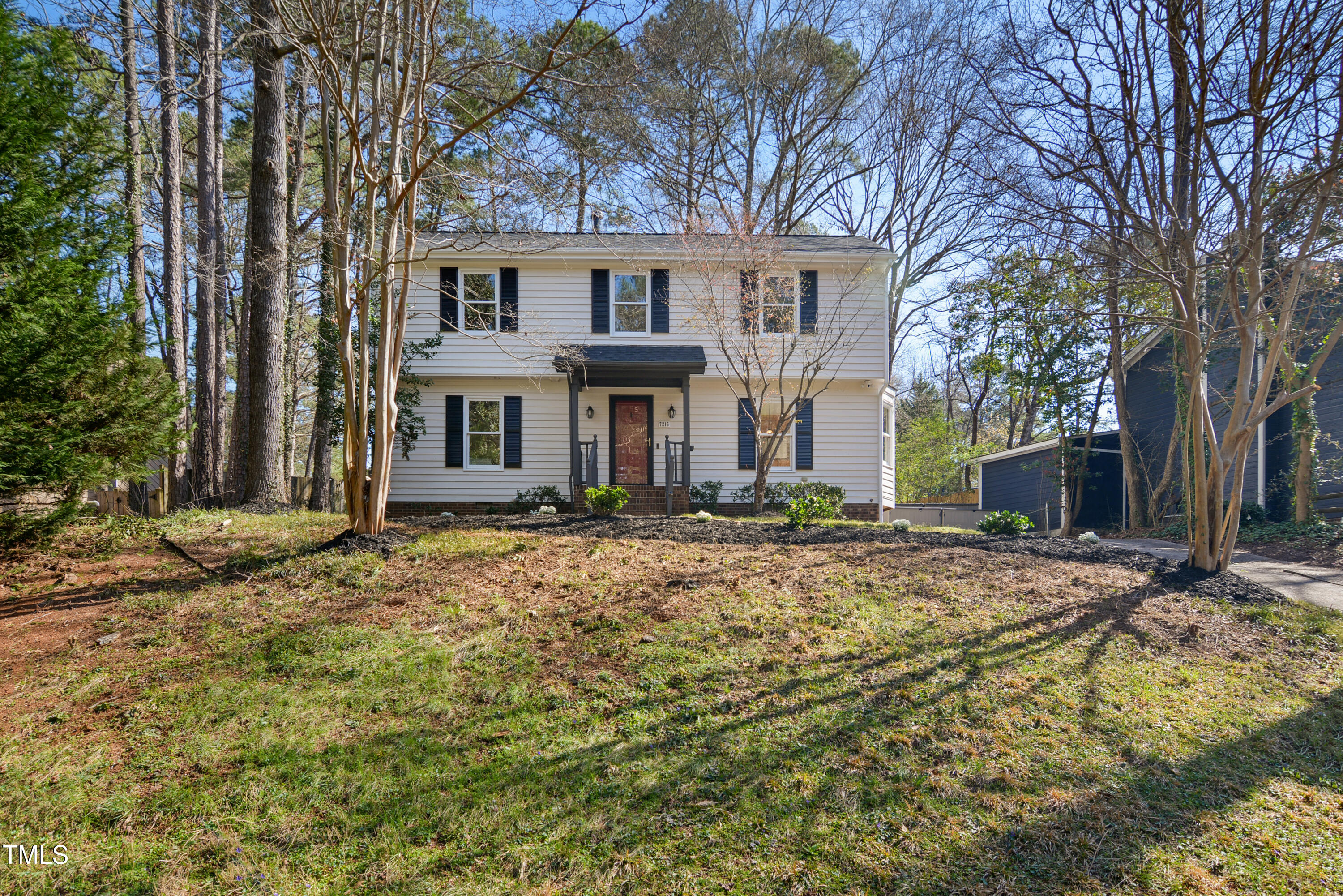 7216 Bluffside Court Raleigh, NC 27615 - Photo 1 of 22 a front view of a house with a yard