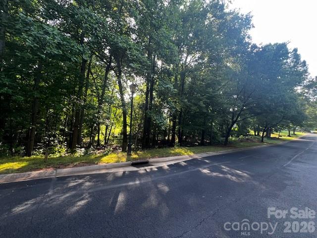 8112 Bay View Drive, Unit 32 Belmont, NC 28012 - Photo 6 of 7 a view of yard with yellow and trees