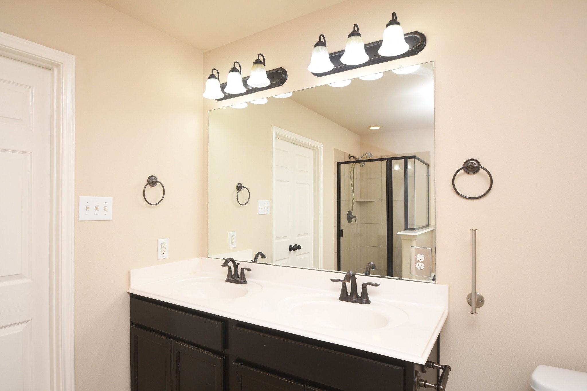 10015 Bitternut Hickory Lane Tomball, TX 77375 - Photo 18 of 36 a bathroom with a sink vanity and mirror