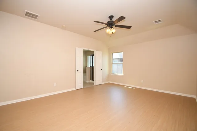 a view of an empty room with a window