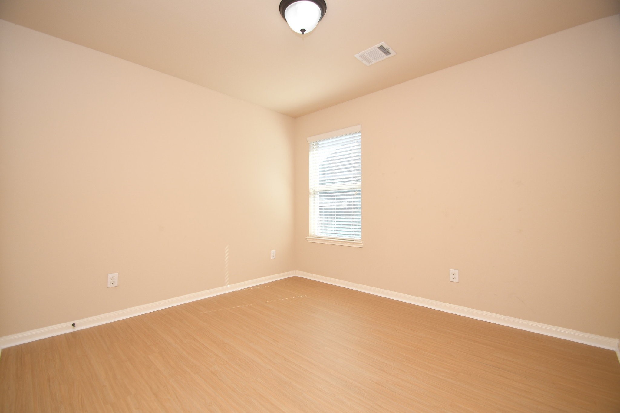 10015 Bitternut Hickory Lane Tomball, TX 77375 - Photo 30 of 36 a view of an empty room with a window