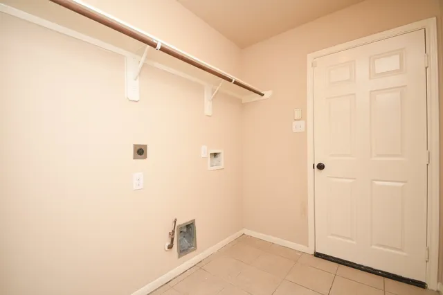 a bathroom with a shower and a window