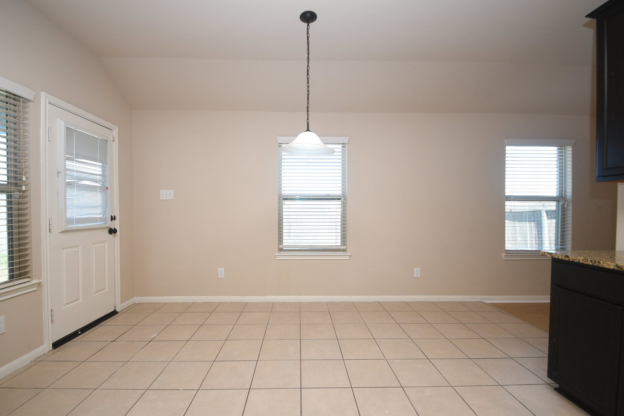 10015 Bitternut Hickory Lane Tomball, TX 77375 - Photo 33 of 36 a view of an empty room with window and cabinet