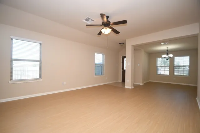 a view of an empty room with a window