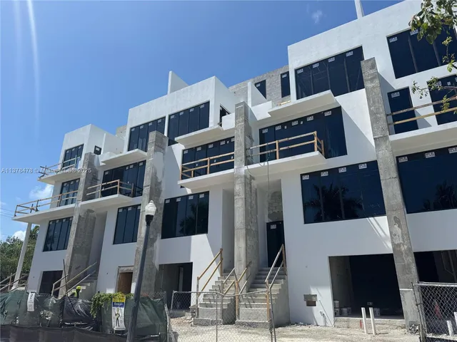 a front view of a building with lot of windows