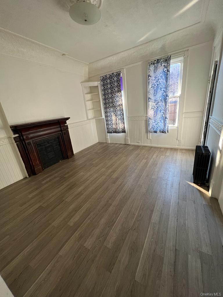 119 Chambers Street Newburgh, NY 12550 - Photo 13 of 18 a bedroom with a bed and a window