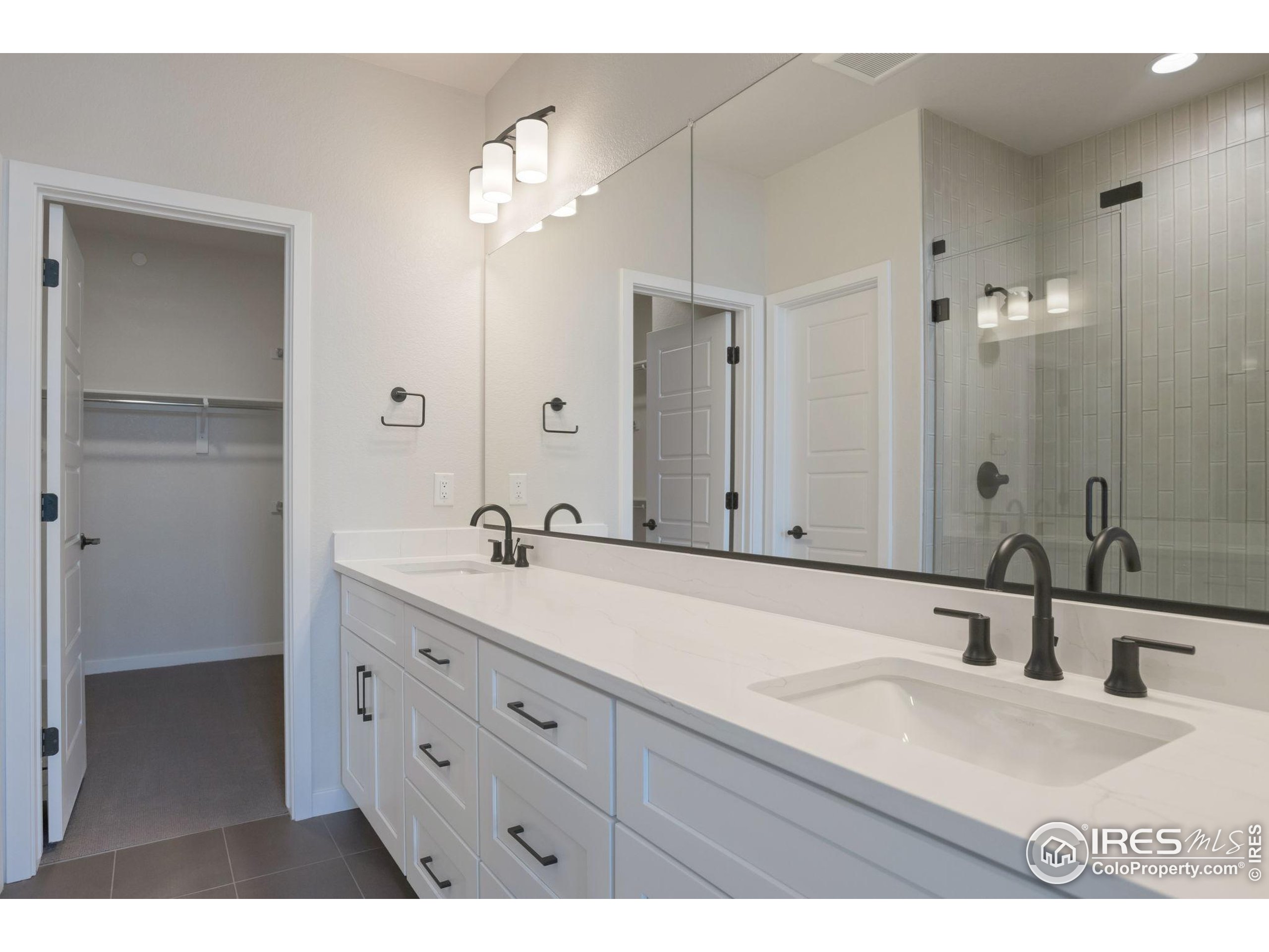 352 Marshall Road Superior, CO 80027 - Photo 12 of 30 a bathroom with a sink double vanity and a mirror