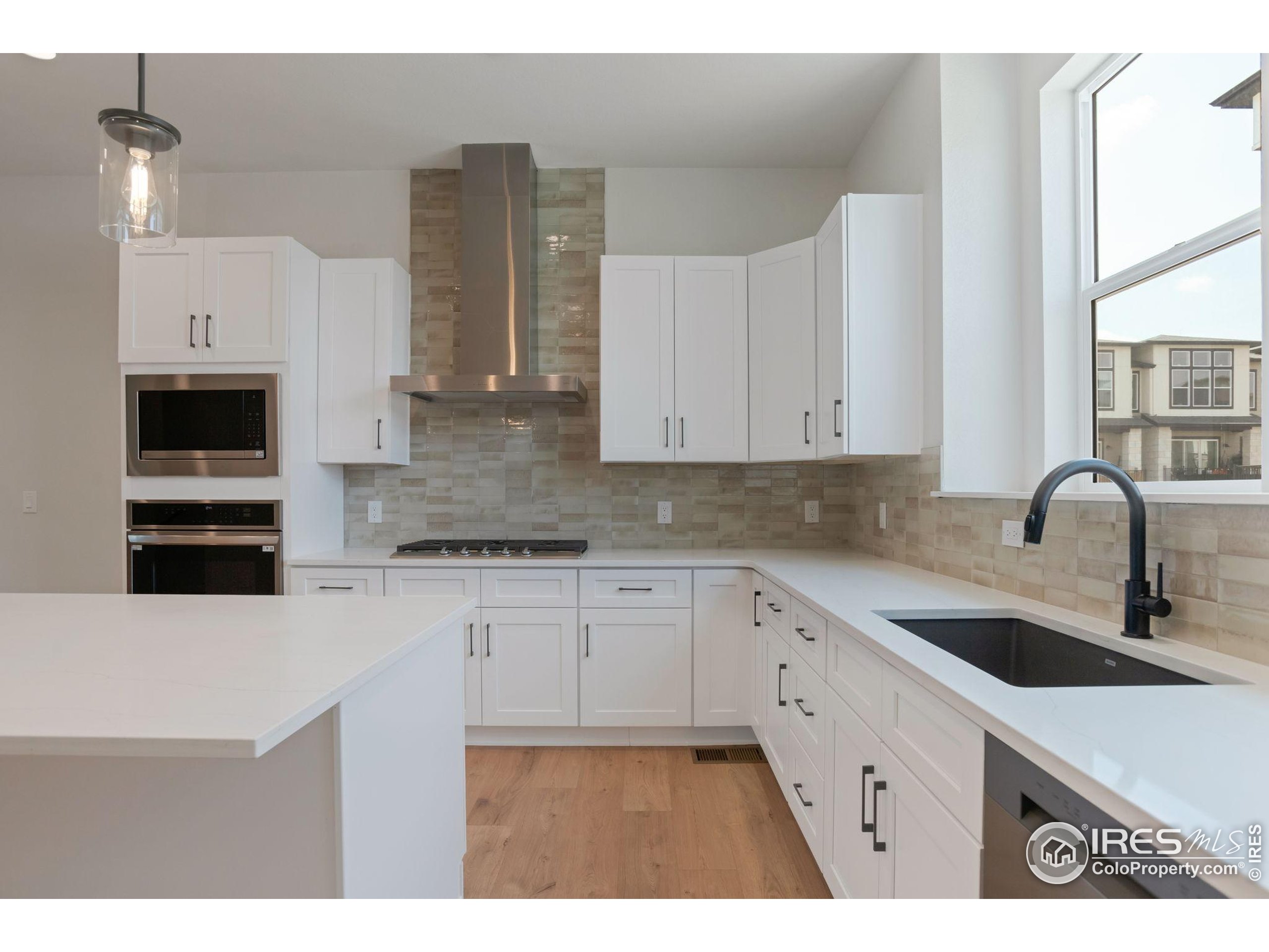 352 Marshall Road Superior, CO 80027 - Photo 2 of 30 a kitchen with stainless steel appliances granite countertop a sink stove and refrigerator