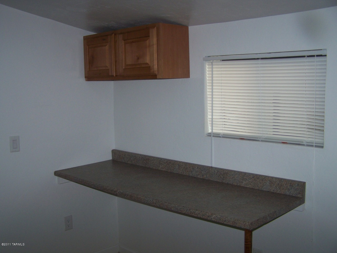 456 West Thurber Road Tucson, AZ 85705 - Photo 12 of 15 a view of a small space with wooden floor and a window