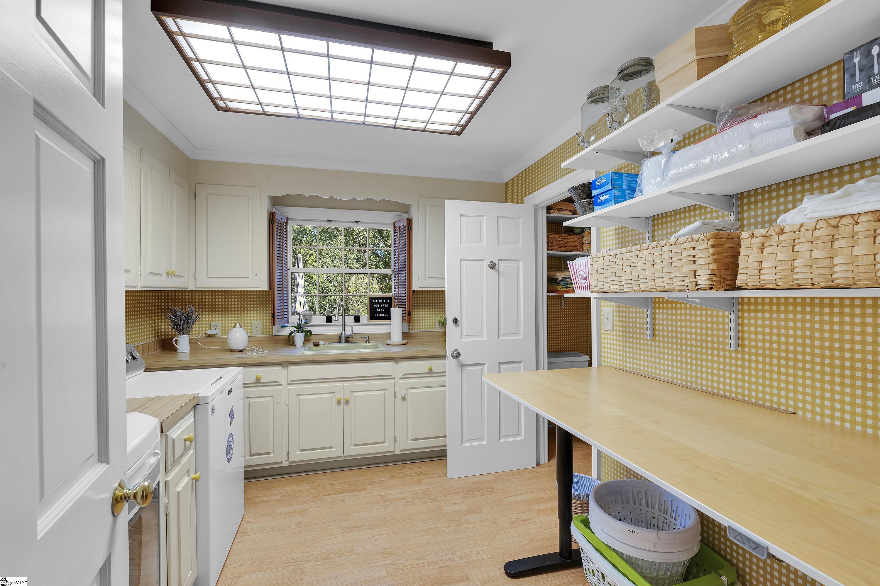 102 Graystone Road Greenville, SC 29615 - Photo 19 of 50 With sink and an attached half bath