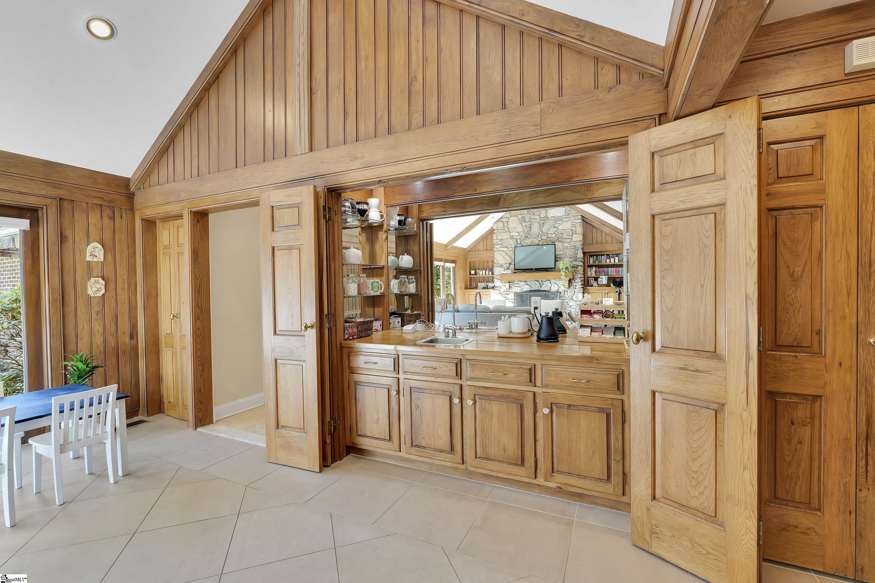 102 Graystone Road Greenville, SC 29615 - Photo 36 of 50 Solid wood doors enclose the bar