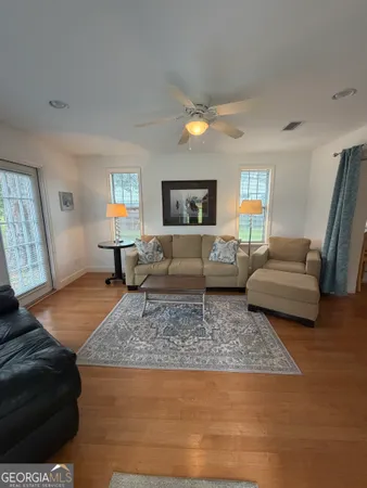 a living room with furniture and a rug