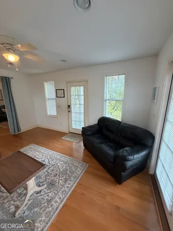 a living room with a couch and a rug