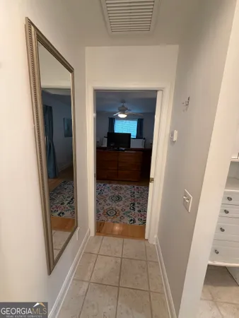 a view of a hallway view with wooden floor and staircase