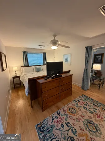 a bed room with a bed and a television
