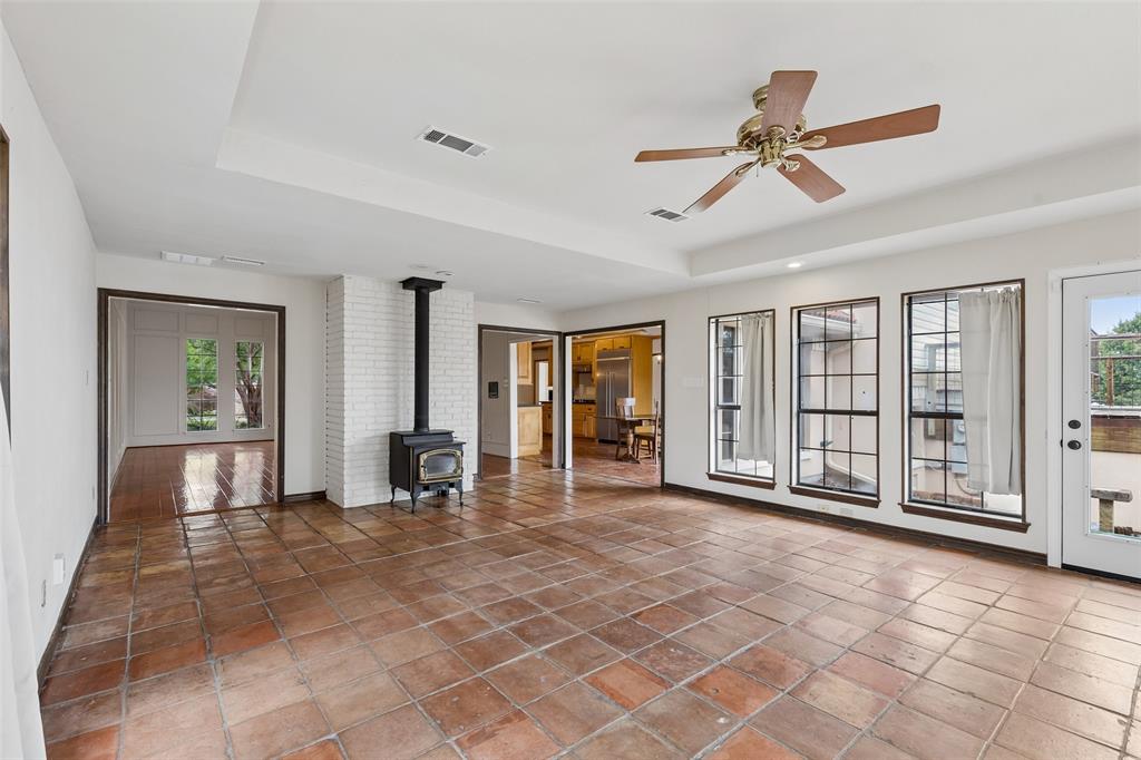 4 Eastshore Road Heath, TX 75032 - Photo 13 of 37 a view of a livingroom with wooden floor and a ceiling fan