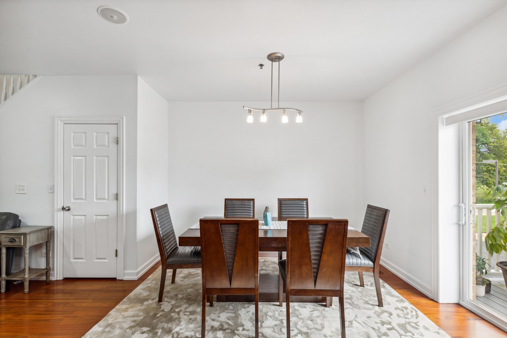 183 East River Road, Unit D2 Des Plaines, IL 60016 - Photo 12 of 42 a view of a dining room with furniture window and wooden floor
