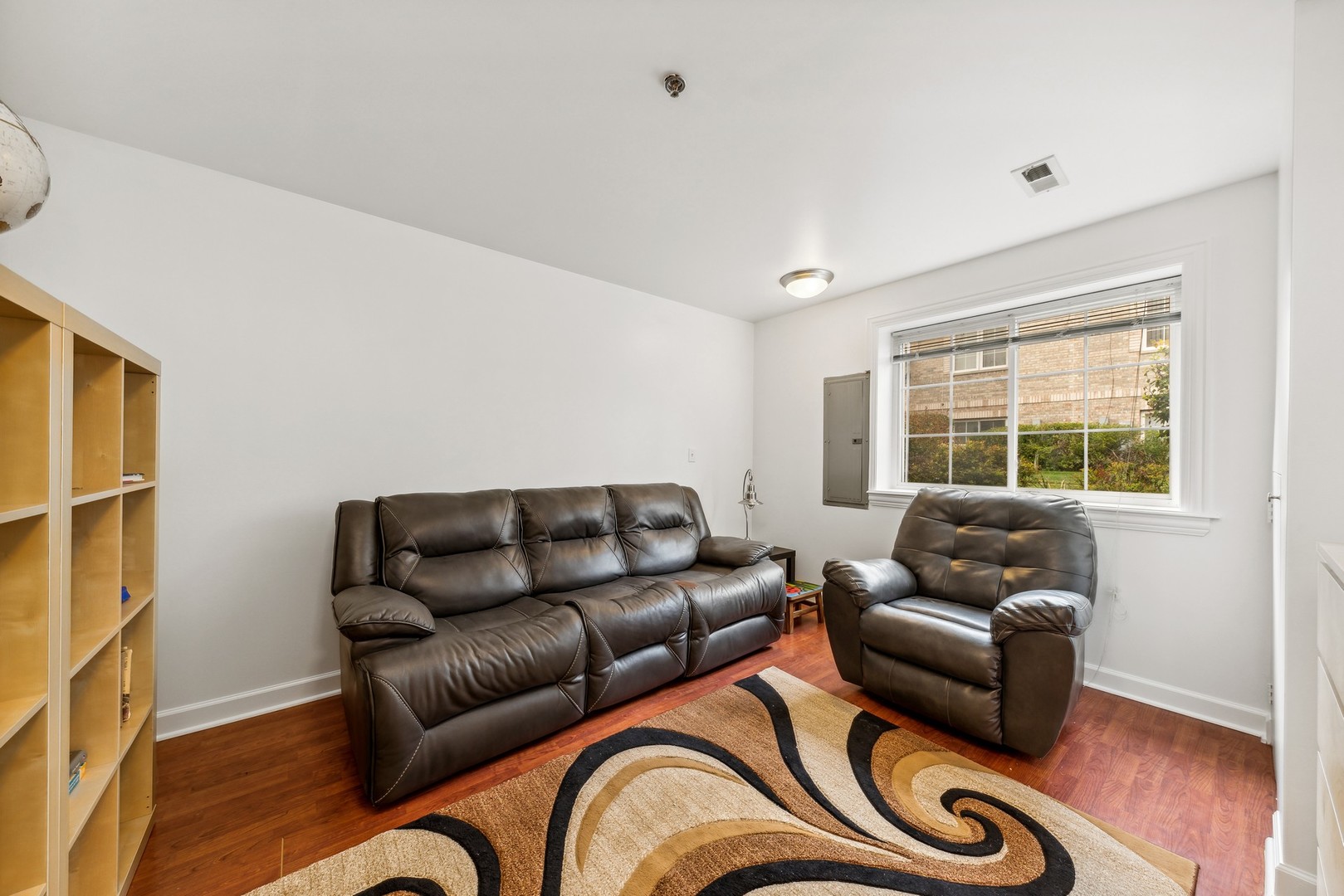 183 East River Road, Unit D2 Des Plaines, IL 60016 - Photo 27 of 42 a living room with furniture and a window