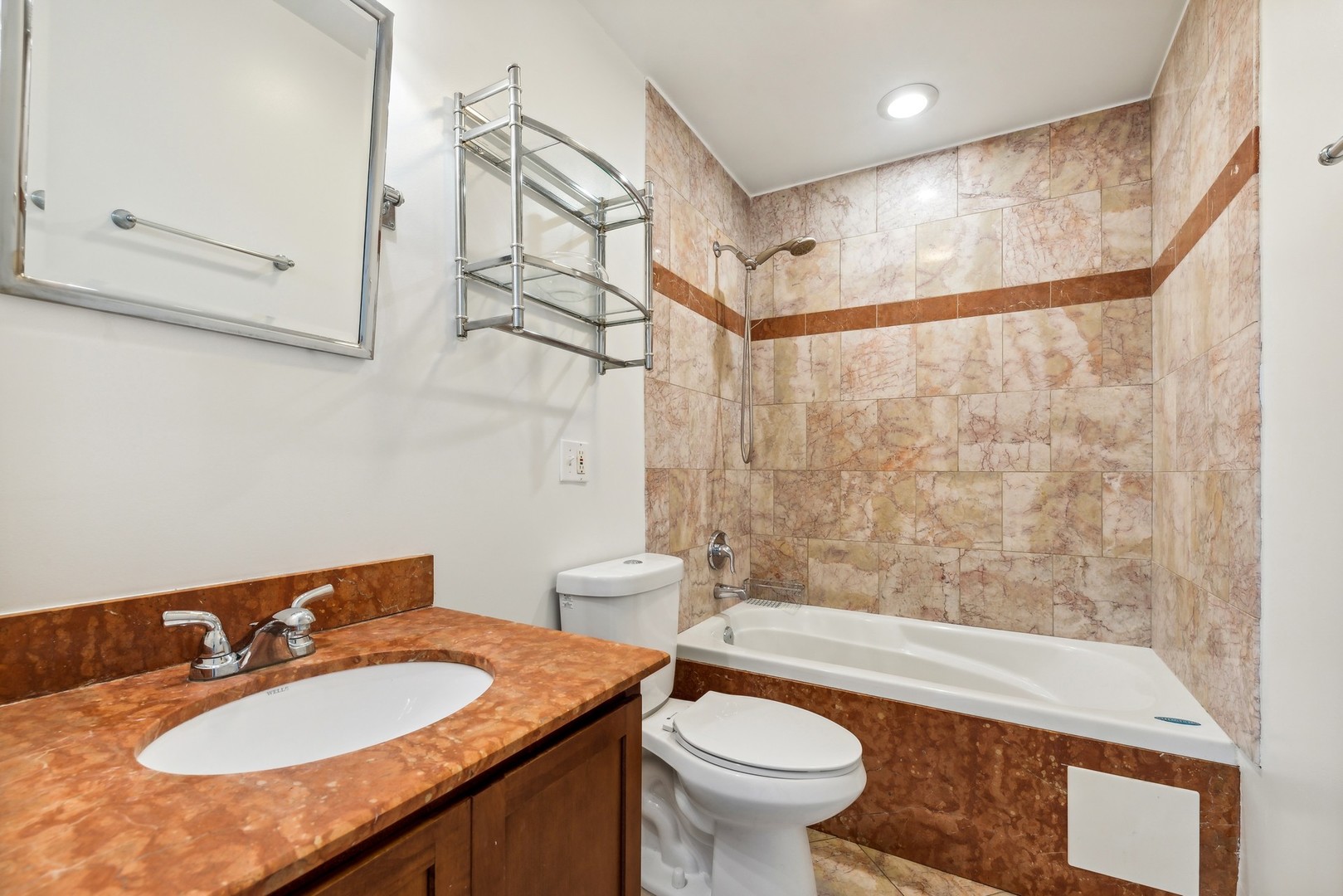 183 East River Road, Unit D2 Des Plaines, IL 60016 - Photo 29 of 42 a bathroom with a sink a toilet and shower