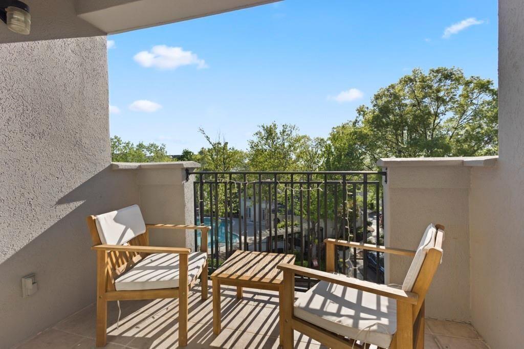 970 Sidney Marcus Boulevard Northeast, Unit 2408 Atlanta, GA 30324 - Photo 19 of 27 a view of a balcony with furniture