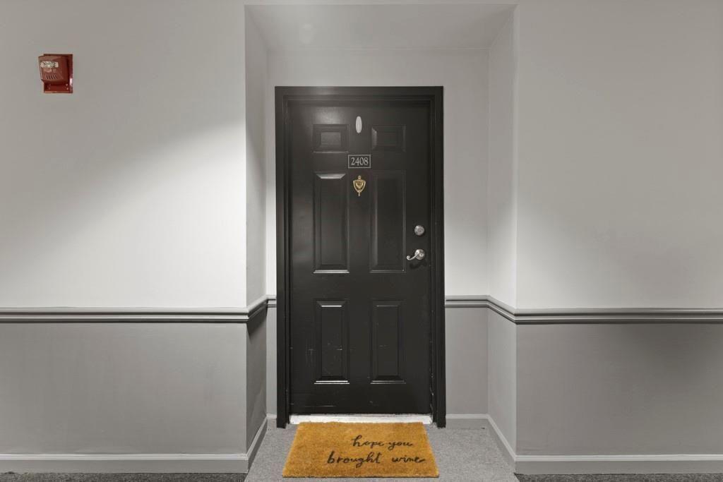 970 Sidney Marcus Boulevard Northeast, Unit 2408 Atlanta, GA 30324 - Photo 20 of 27 a bathroom with a shower