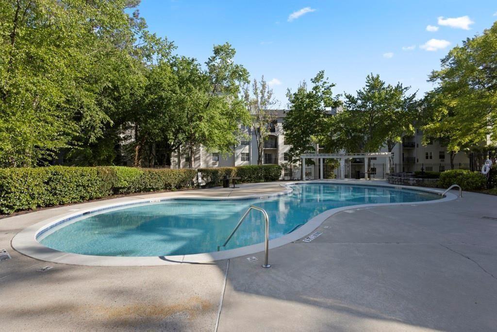 970 Sidney Marcus Boulevard Northeast, Unit 2408 Atlanta, GA 30324 - Photo 24 of 27 a view of a house with a yard