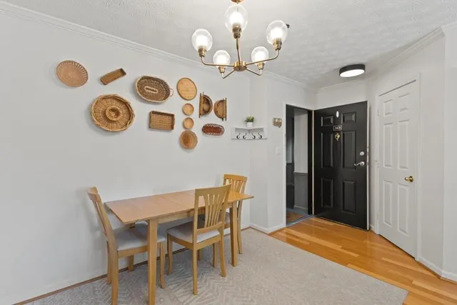 a view of a dining area with furniture and wooden floor