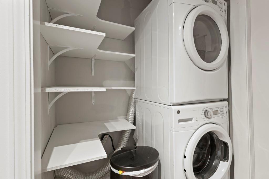970 Sidney Marcus Boulevard Northeast, Unit 2408 Atlanta, GA 30324 - Photo 9 of 27 a utility room with dryer and washer