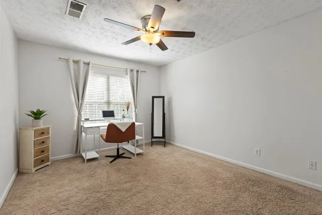 a workspace with furniture and window