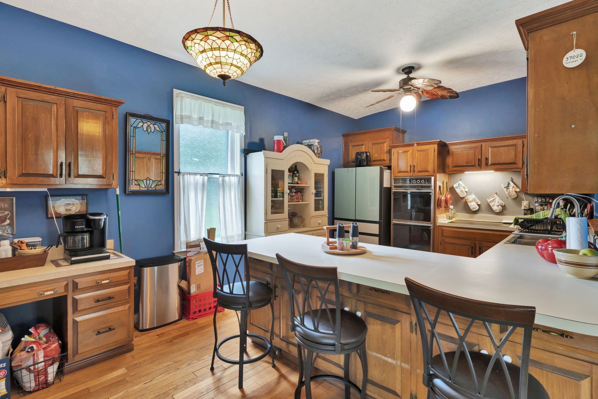 1005 Les Brown Road Bethpage, TN 37022 - Photo 13 of 57 a view of a dining room with furniture a chandelier and wooden floor