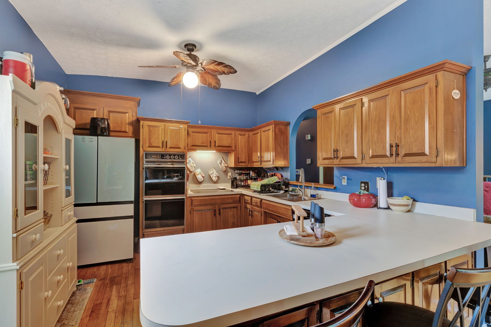 1005 Les Brown Road Bethpage, TN 37022 - Photo 14 of 57 a kitchen with stainless steel appliances wooden floor dining table and chairs
