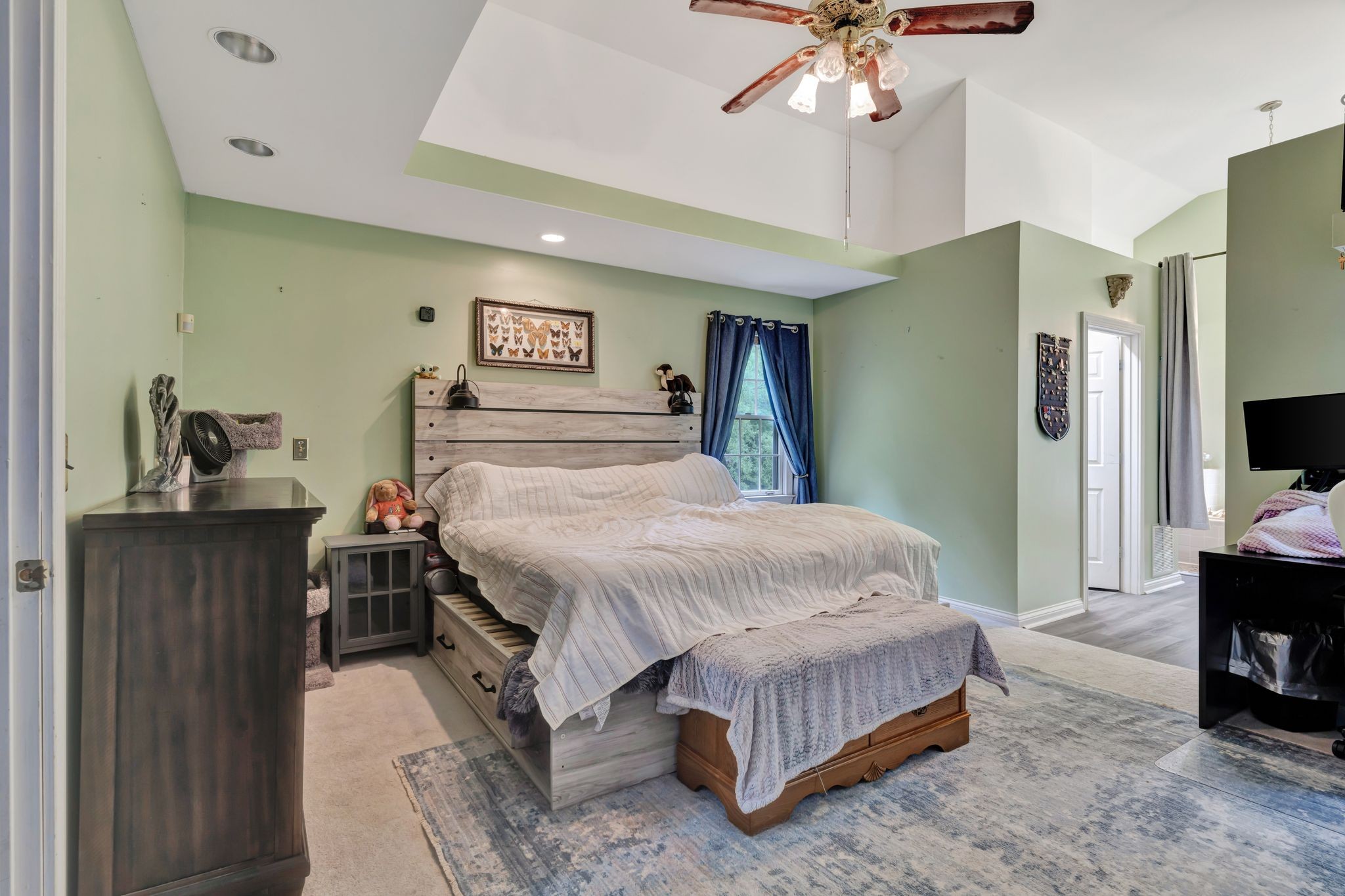 1005 Les Brown Road Bethpage, TN 37022 - Photo 24 of 57 a spacious bedroom with a bed and a flat tv screen on dresser
