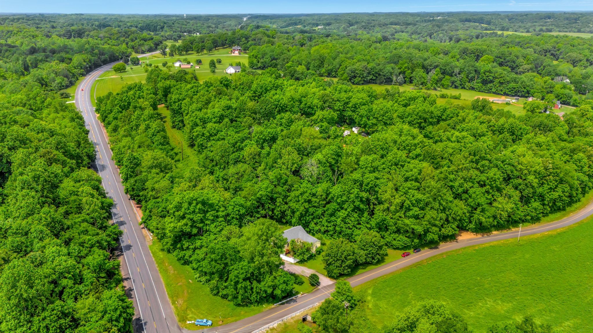 1005 Les Brown Road Bethpage, TN 37022 - Photo 3 of 57 an aerial view of residential house with outdoor space and trees