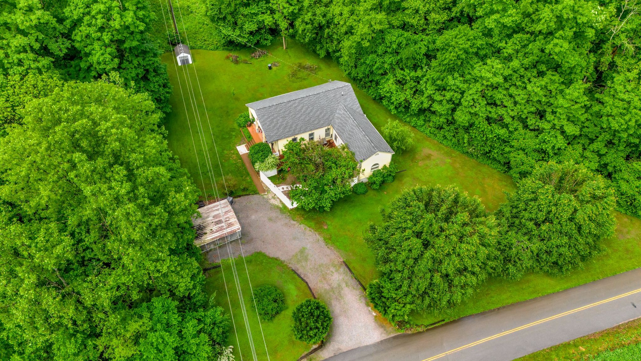 1005 Les Brown Road Bethpage, TN 37022 - Photo 5 of 57 an aerial view of a house with a yard and lake view