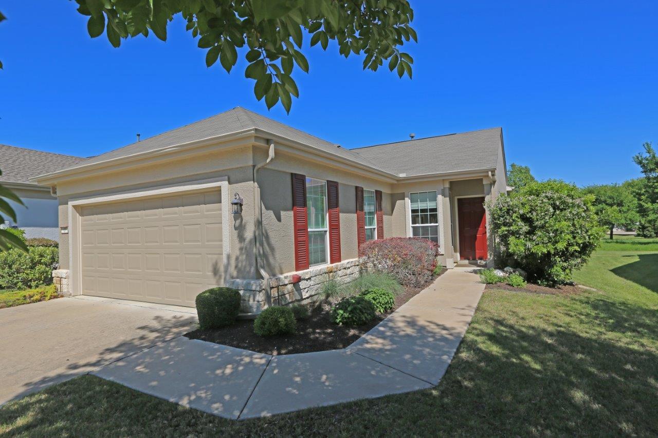109 Ranier Lane Georgetown, TX 78633 - Photo 1 of 18 A welcoming facade with a garage, front door, and lush landscaping offers charming curb appeal.
