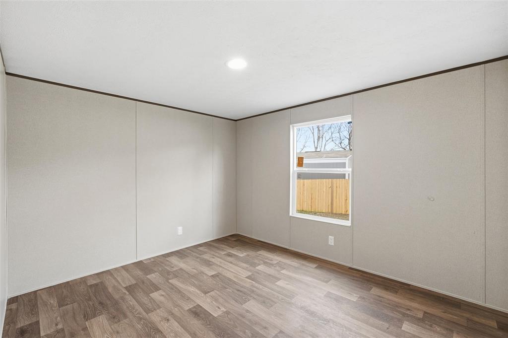 618 East 6th Street, Unit B Blum, TX 76627 - Photo 16 of 24 an empty room with windows and closet