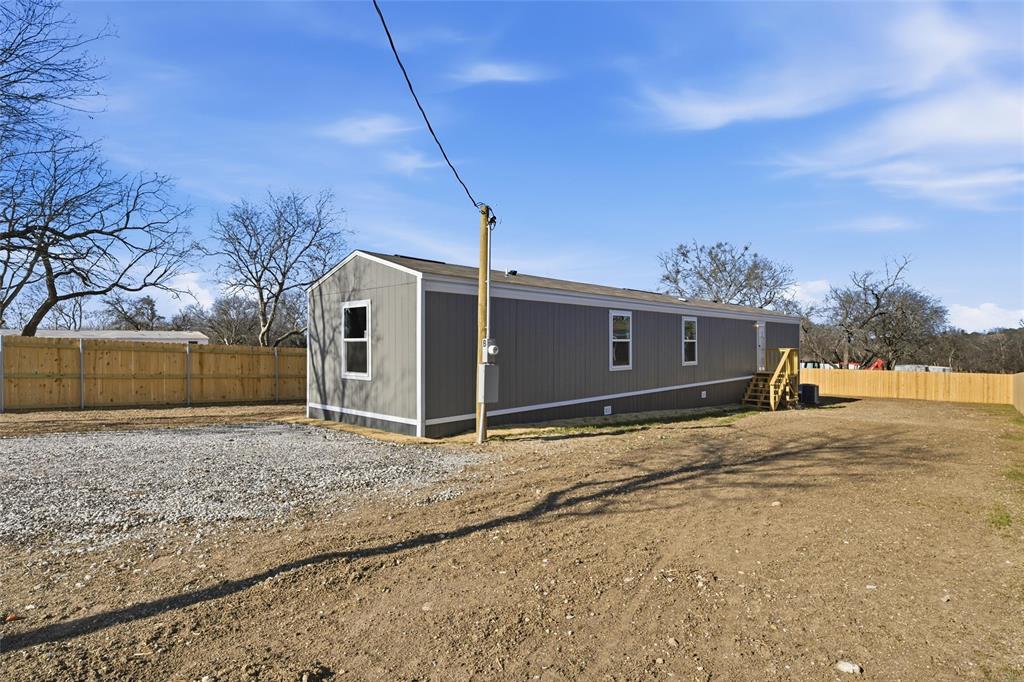 618 East 6th Street, Unit B Blum, TX 76627 - Photo 23 of 24 a backyard of a house