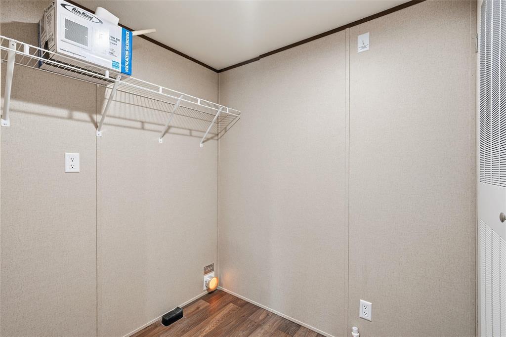 618 East 6th Street, Unit B Blum, TX 76627 - Photo 10 of 24 a view of a room with racks on the wall