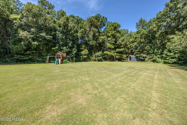 a view of yard with a trees