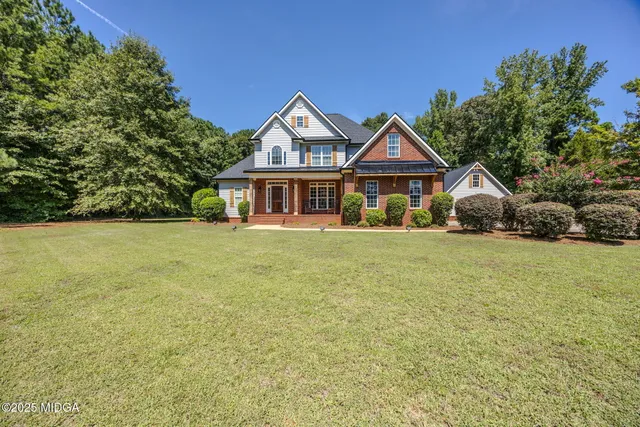 a house with trees in the background