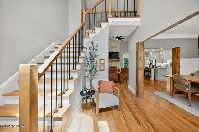 a view of entryway livingroom and hall with wooden floor