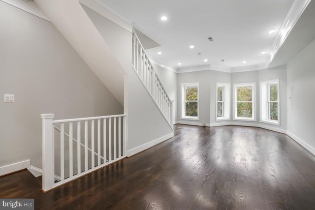 a view of an entryway with wooden floor